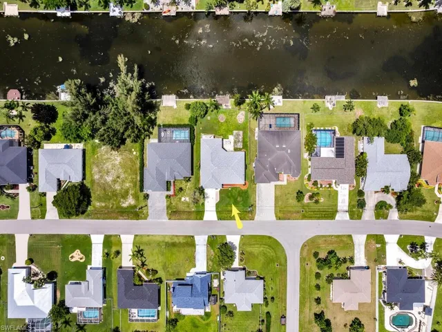Aerial perspective of suburban area with a large body of water