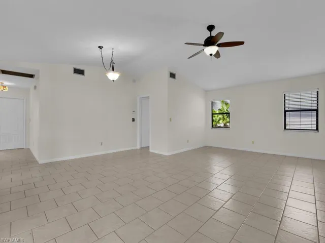View of the living room  and front door foyer area. Plenty of light