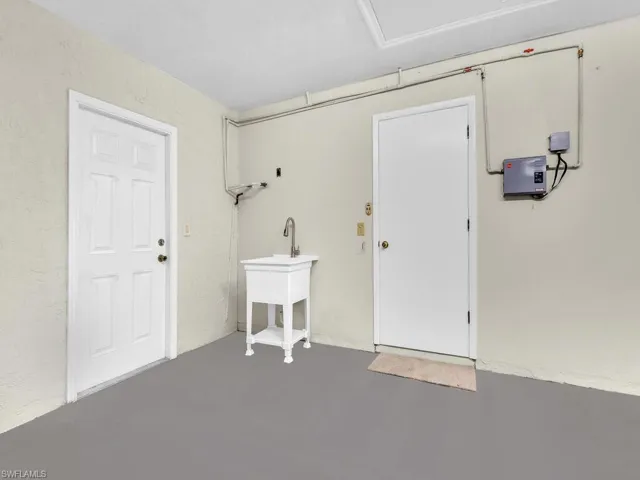 Garage featuring a garage door opener
