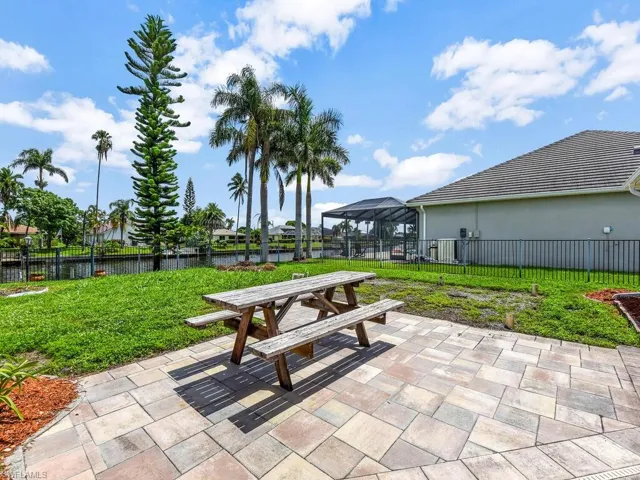 View of yard featuring a water view and a patio area