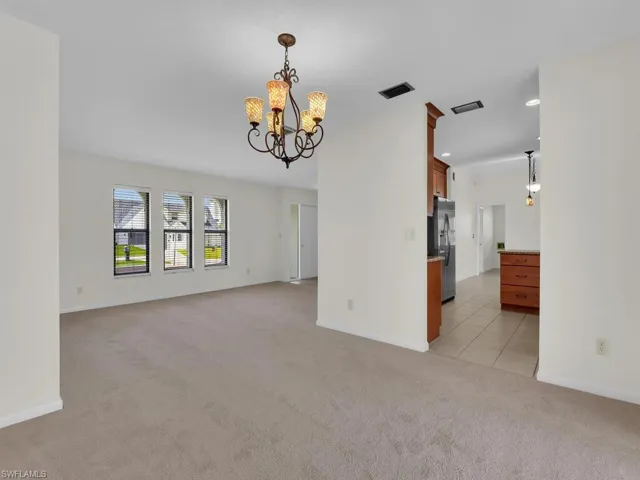 Living area with carpet flooring. Virtual staging imposed