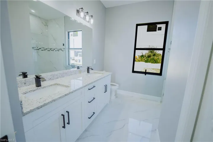 Bathroom with vanity and toilet