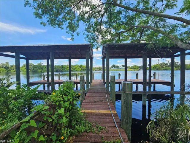 Dock area featuring a water view