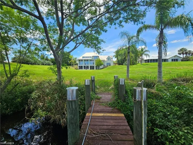 View of dock featuring a yard