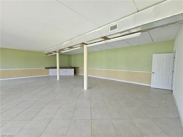 Basement featuring light tile patterned floors