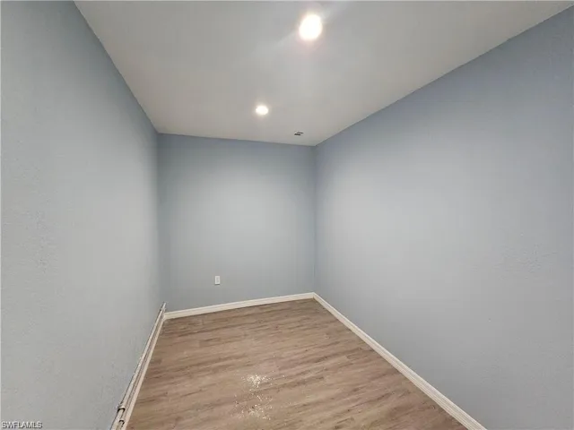 Unfurnished room with light hardwood / wood-style flooring