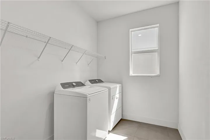 Laundry room with washer and gas dryer
