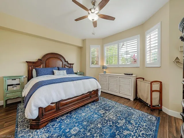 The Primary owner's suite with a lovey water view features tile floors, ten foot ceilings, two closet storage areas with your own private access to the lanai area.