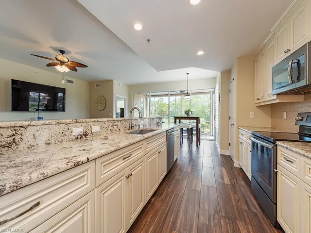 The kitchen features granite counter tops, stainless steel appliances, a pantry and loads of storage space!