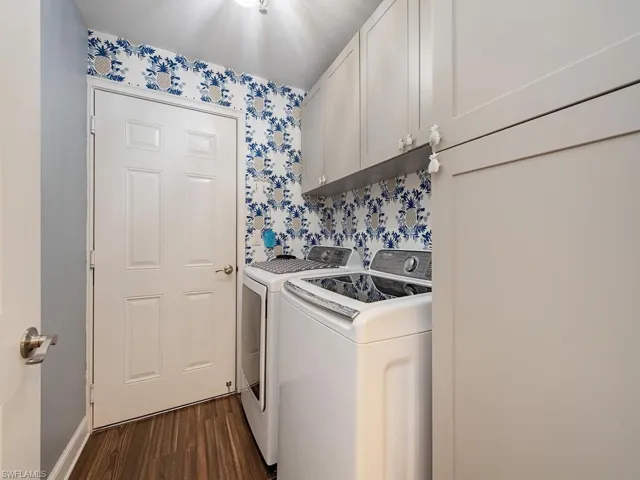 Laundry area just off of the garage hosts the washer and dryer, and lots of extra cabinet space!