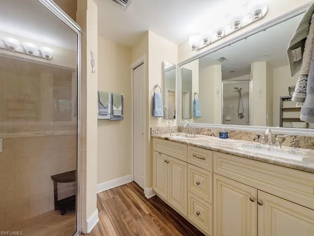The Primary suite has it own private bath with large mirror, level 5 granite counter, dual sinks, a stall shower, linen closet and tile floors.