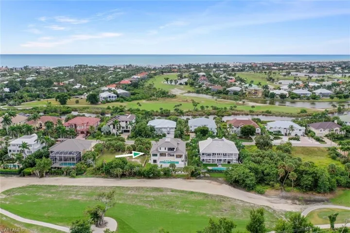Aerial view highlighting surrounding community and green spaces.