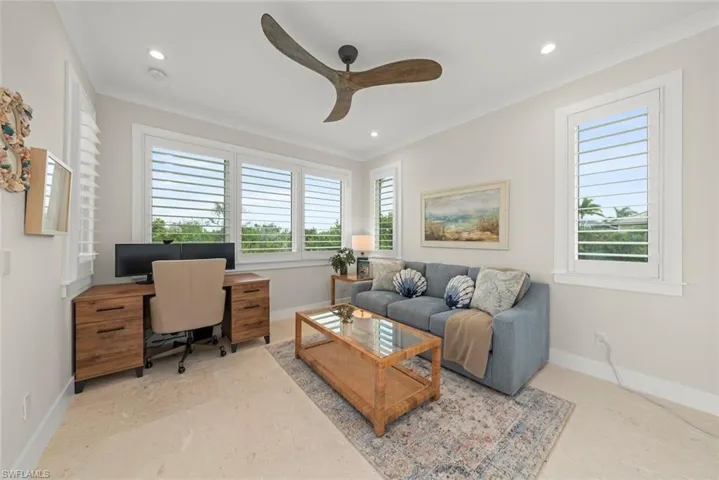 Private office space featuring custom built-ins and functional workspace.