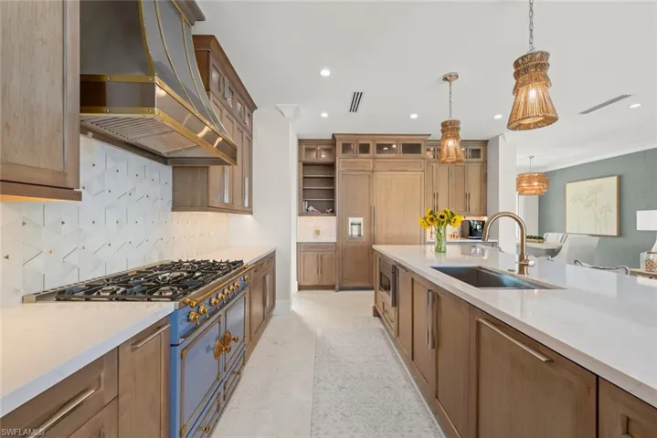 Kitchen workspace with ample counters and cabinetry.