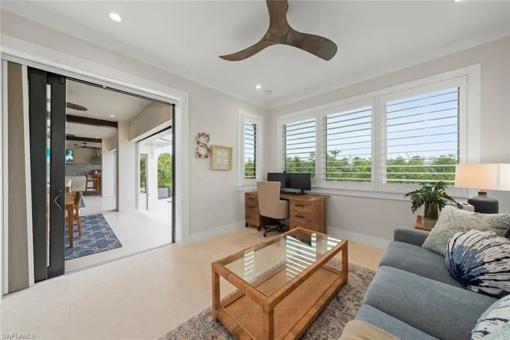 Office area with easy balcony access to capture fresh air and views.