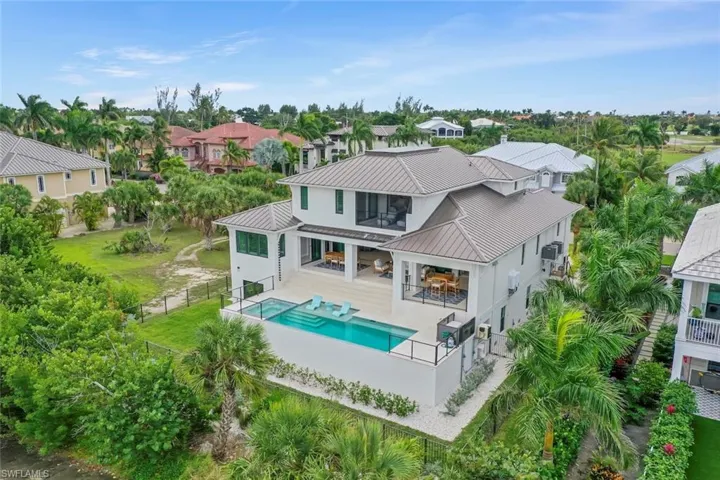 Aerial view capturing the home’s impressive scale and scenic neighborhood location.