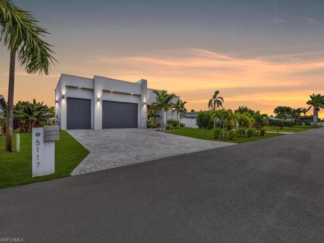 Wide Drive w/ Pavers & New Tropical Landscaping