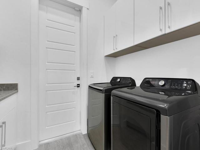 Laundry Room w/ Utility Sink & Cabinetry