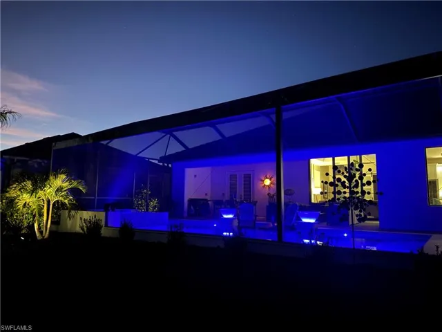 View of patio featuring glass enclosure
