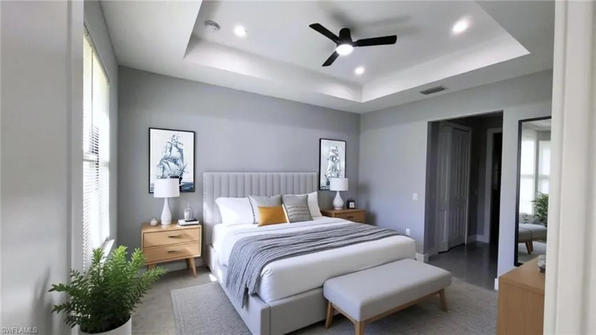 Virtual staging. Bedroom featuring a tray ceiling, a ceiling fan, and recessed lighting