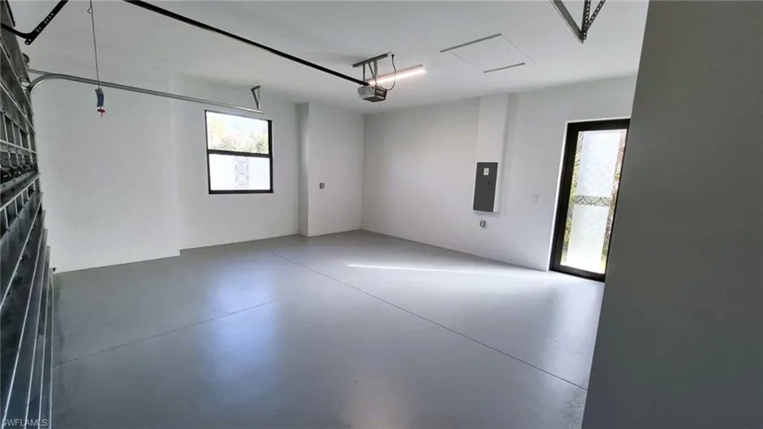 Garage featuring electric panel