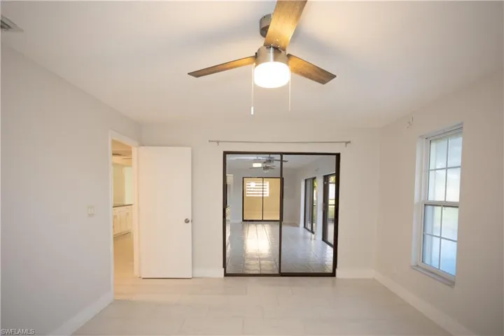 Unfurnished room featuring ceiling fan
