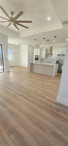 Entrance to property featuring french doors and stucco siding