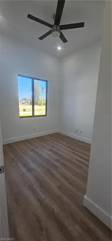 Bathroom with a shower stall, vanity, and light wood finished floors
