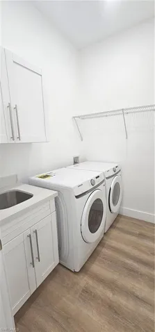 Bathroom featuring toilet and wood finished floors