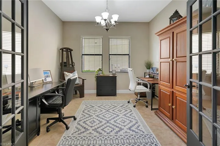 Office (Den/Formal Dining/4th Bedroom) area featuring french doors, a chandelier, and light tile patterned flooring
