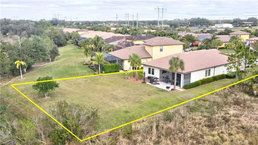 Aerial view of residential area with property boundaries highlighted