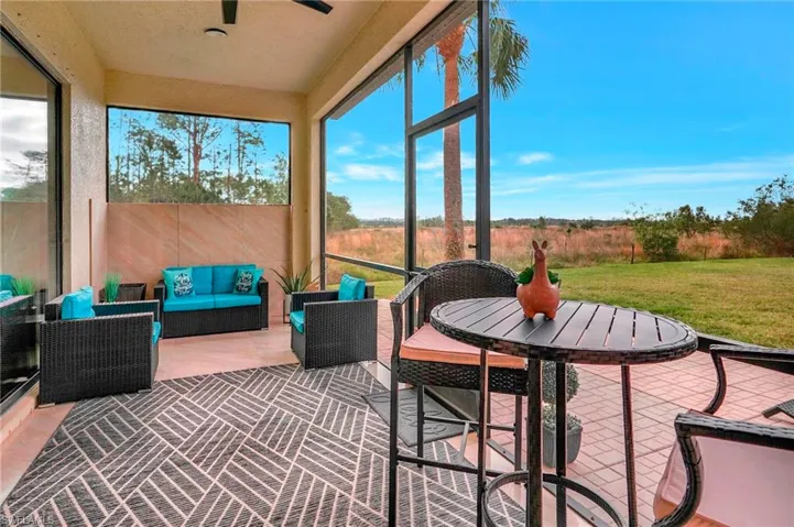 Lanai featuring outdoor lounge area and outdoor dining space