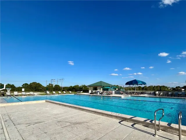 Community pool featuring a patio area