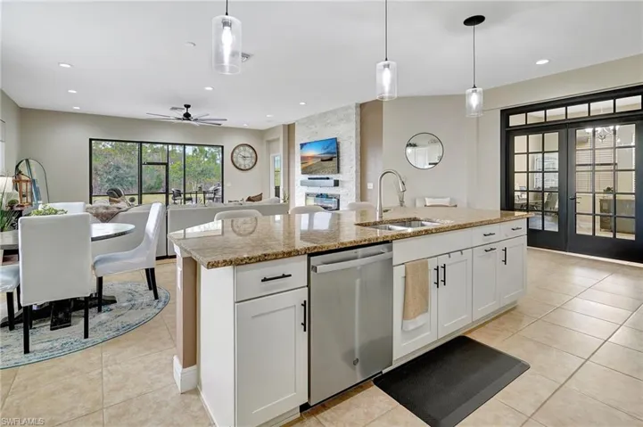 Kitchen with pendant lighting, white cabinetry, granite counters, and recessed lighting