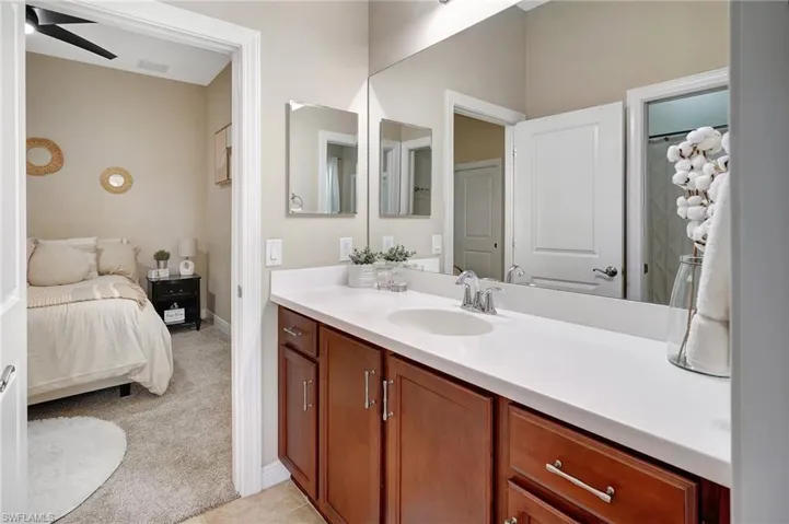 Jack & Jill Bathroom with vanity and ceiling fan