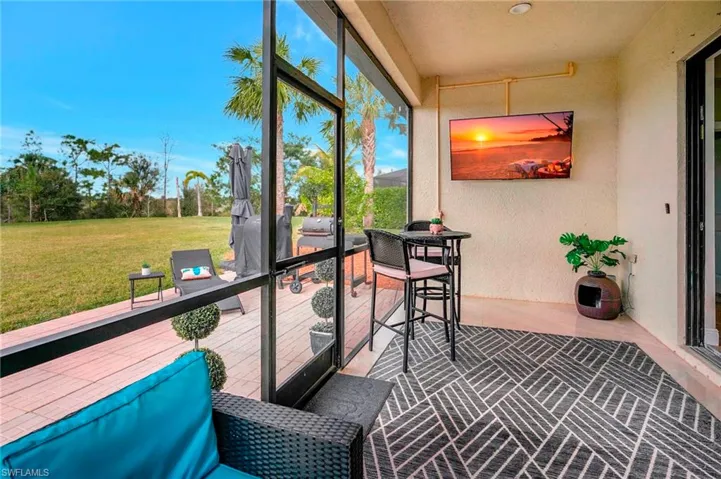 View of Lanai with ceiling fan and TV