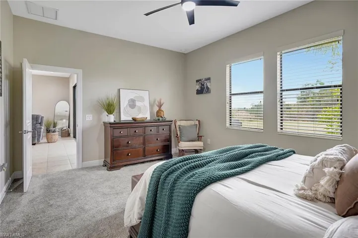 Bedroom featuring carpet and a ceiling fan