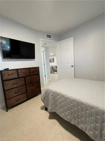 Bedroom featuring light tile patterned flooring