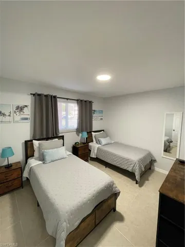 Bedroom with light tile patterned floors