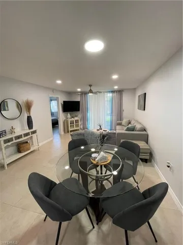 Living area featuring recessed lighting and light tile patterned floors