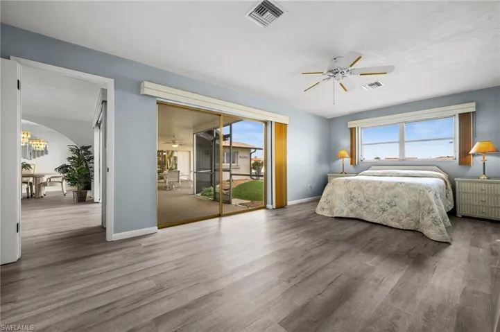 Primary Bedroom opens to the Screened Lanai