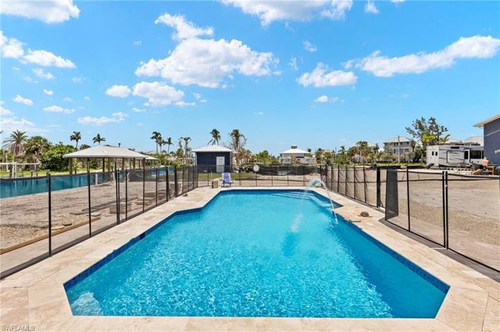 Upgraded private pool overlooking the dock and canal.