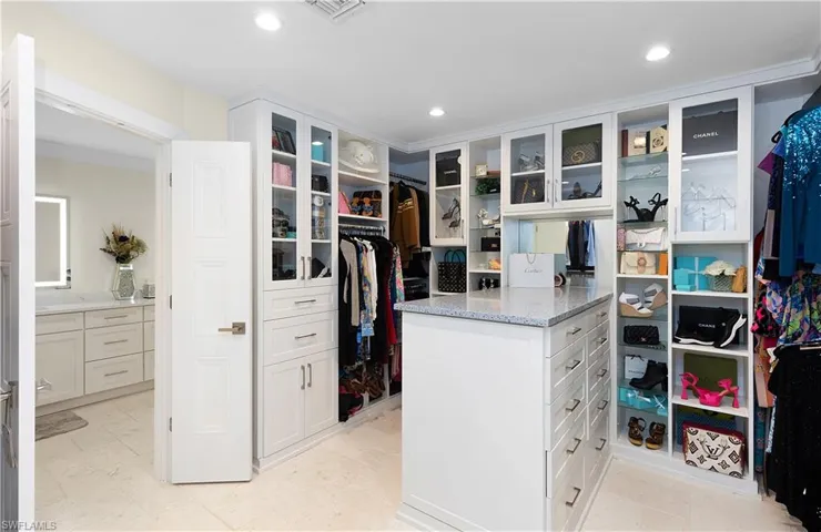 Walk in closet with visible vents