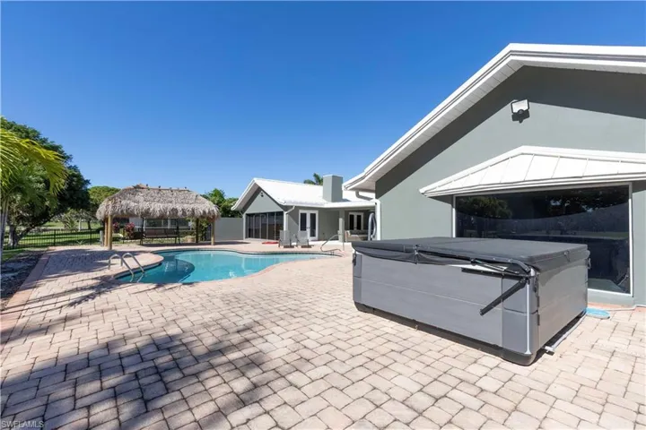 View of swimming pool with a fenced in pool, a patio, a hot tub, a gazebo, and fence