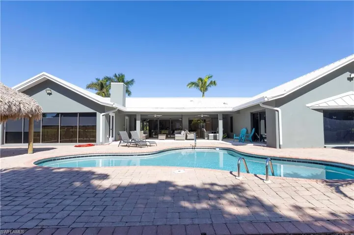 Pool with a patio area and a ceiling fan