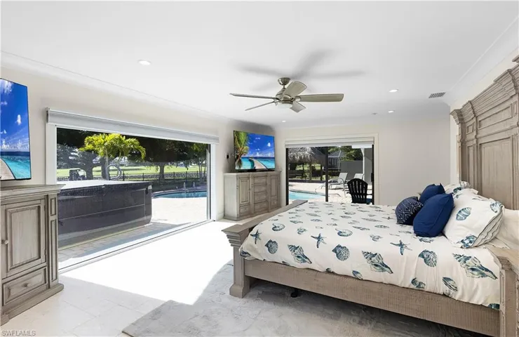 Bedroom featuring access to exterior, recessed lighting, and ornamental molding