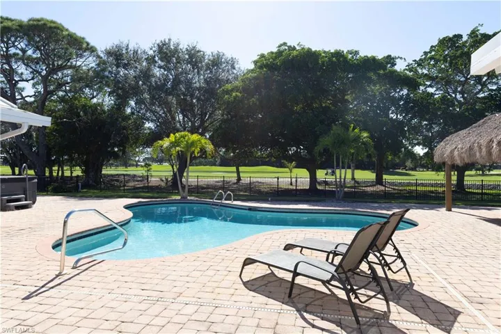 View of pool featuring a patio area, fence, and a fenced in pool