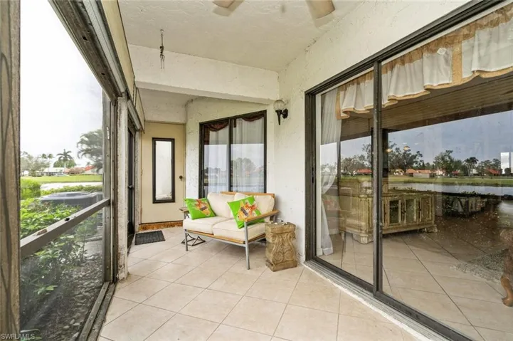 Sunroom / solarium featuring ceiling fan