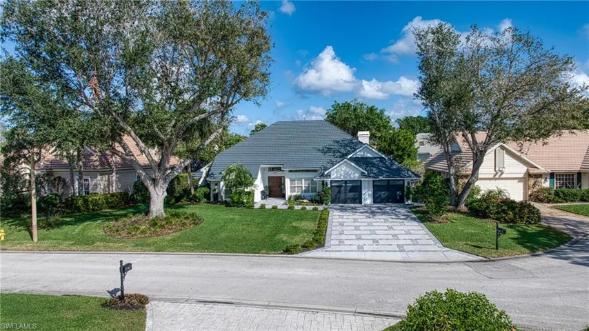 View of front of property with a front yard