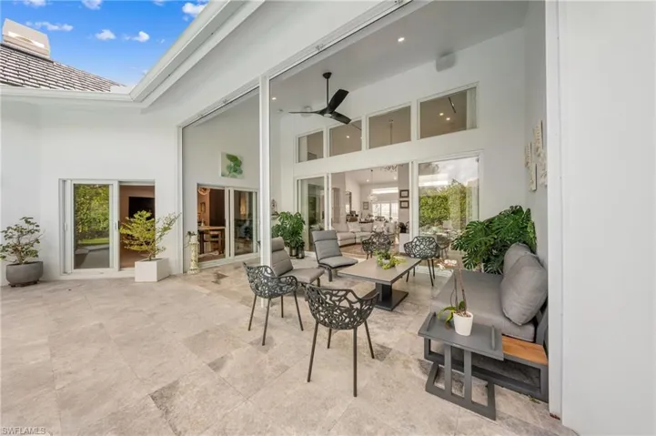 View of patio featuring outdoor lounge area and ceiling fan